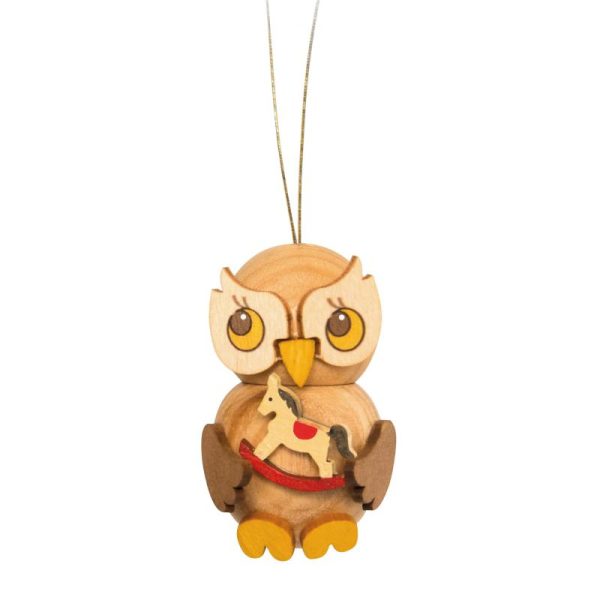 Owl child with rocking horse